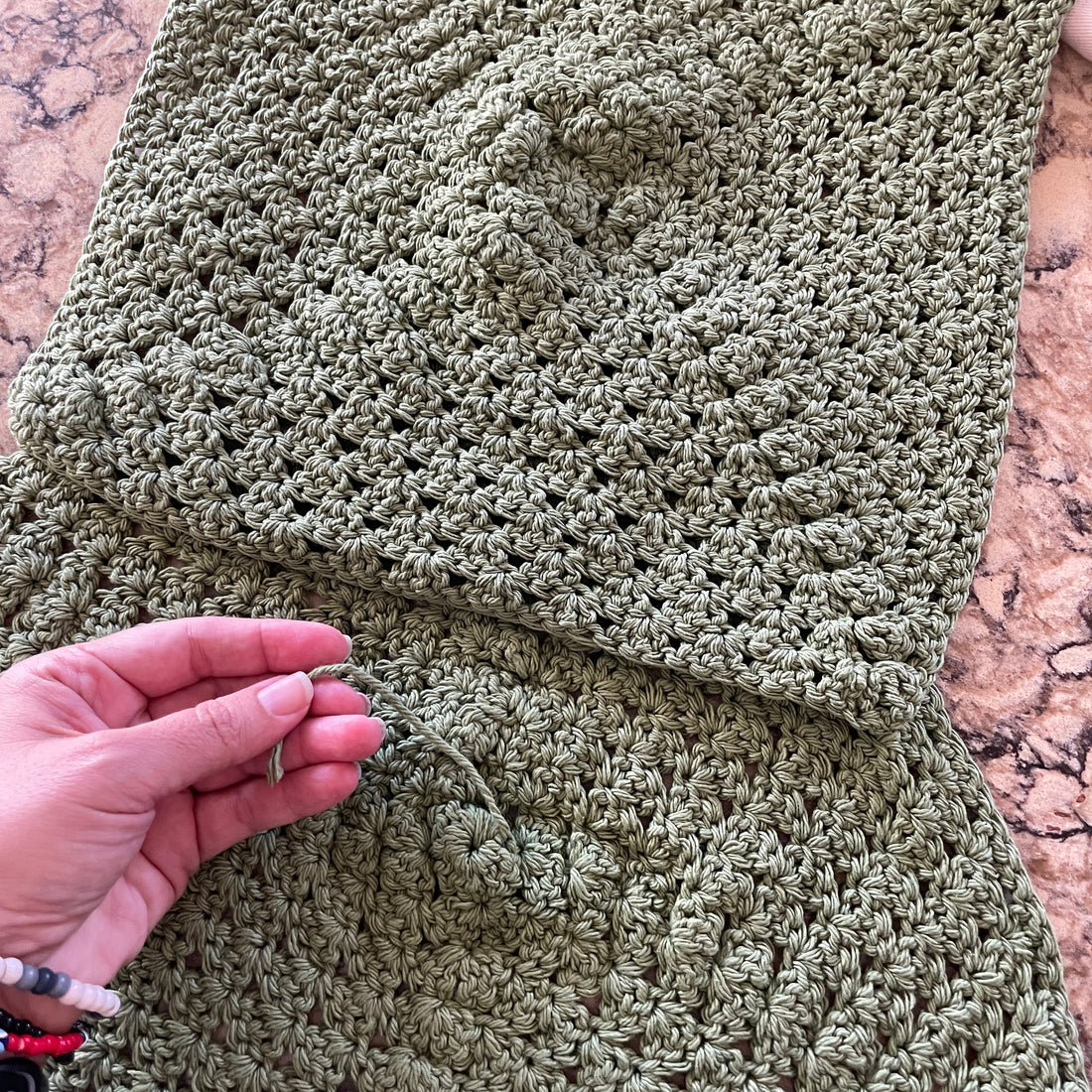 One crocheted square has the six-inch tail and one does not.  Because I did not follow instructions the first time.